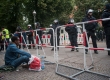 A migrant sit in front of the police in Ohlauer Street in Berlin