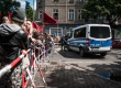 People in solidarity with refugees stand in front of the Police